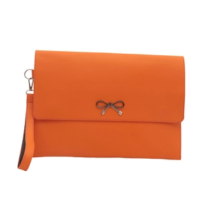 Orange faux leather envelope clutch bag with a metal bow buckle and wristlet strap