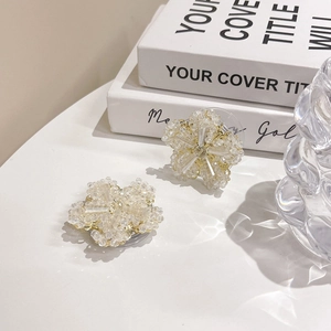 Macro view of handmade floral crystal phone grip with delicate beaded petal details