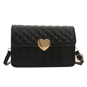 Quilted black crossbody bag with large gold heart buckle and adjustable shoulder strap