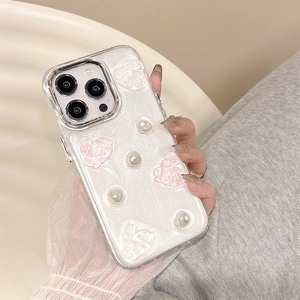 Detail of pearl white iPhone case with 3D bunny embossment and decorative pearls