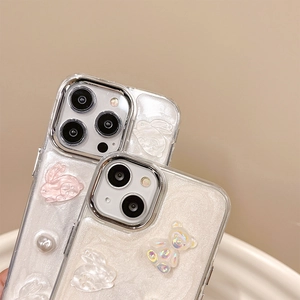 Detail of 3D bear and rabbit charms with iridescent glitter on iPhone case