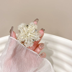 Elegant crystal flower phone socket holder with intricate handmade beaded petals