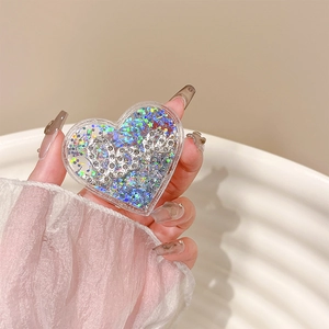 Close-up of heart-shaped phone grip with glittery blue sequins and Love rhinestone detail