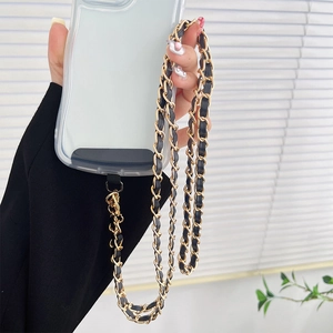 Crossbody phone strap featuring gold chain interwoven with black leather and metal hooks