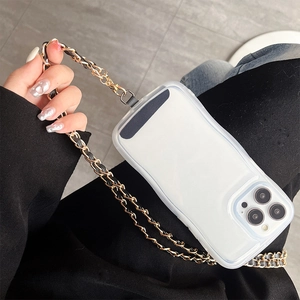 Detail of white wave-edge phone case with black and gold metal leather strap crossbody chain