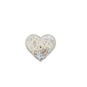 Glittery heart phone grip with flowing sequins and diamond Love text on white background