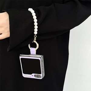 Detail of purple crocodile-pattern Z Flip case with pearl wrist strap and Lucky logo