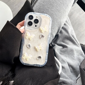 Detail of clear wave edge phone case with 3D white butterflies and rhinestones