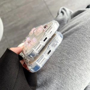 Detail of precise cutouts for charging port and speakers on pink floral iPhone case