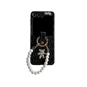 Crocodile texture phone case for Samsung Z Flip with Lucky letters, bear charm, and pearl strap