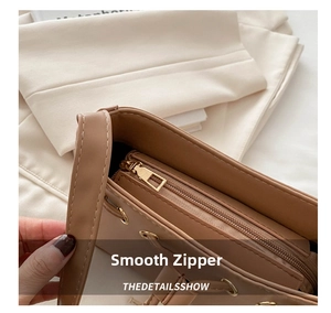 Detailed interior of the khaki faux leather shoulder bag with smooth metal zipper pocket