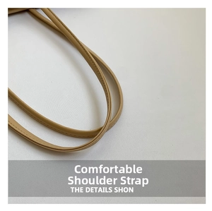Detail of beige leather shoulder strap featuring reinforced double stitching craftsmanship
