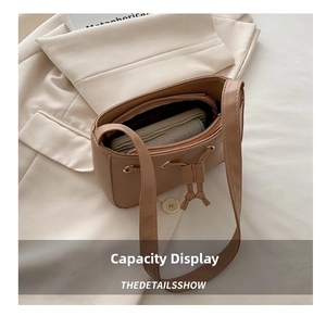 Interior view of brown PU leather shoulder bag showing zipper compartment and storage space