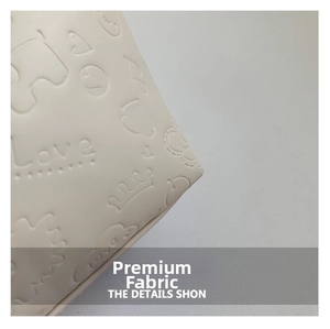 Detail of white faux leather with embossed crown heart and Love text pattern