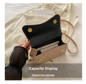 Detailed interior view of the beige heart-quilted crossbody bag showing phone capacity