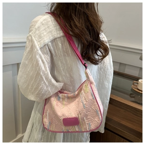 Detail showing pink nylon crossbody bag with FF logo embossing and colorful embroidery
