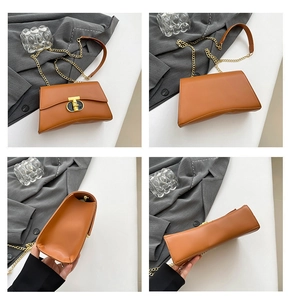 Vue détaillée d'un sac à bandoulière en cuir marron vintage avec fermoir tournant en T doré