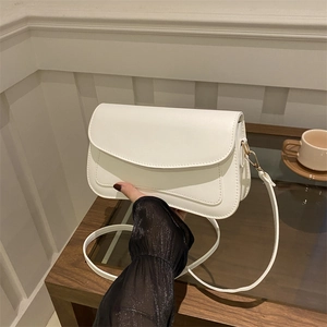 Minimalist white leather small square crossbody bag with gold hardware for daily commute