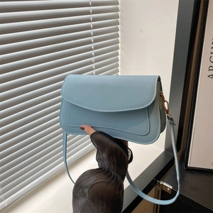 Minimalist light blue rectangular shoulder bag with flap and decorative stitching