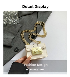 Close-up of a cream PU leather mini bag with gold chain strap and square buckle detail