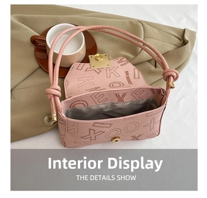 Pink shoulder bag interior showing spacious lining and internal zipper pocket