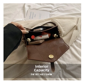 Interior view of brown quilted crossbody bag showing storage for phone and cosmetics
