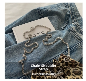 Detail of leopard print bucket bag featuring a vintage silver woven chain strap and canvas