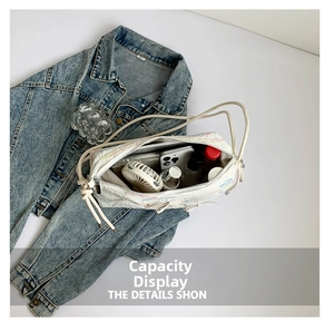 Detailed interior capacity showing daily essentials in a white quilted bow shoulder bag