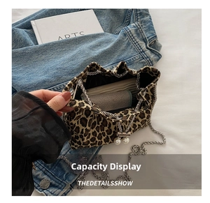 Detail view of the leopard print bucket bag interior showing spacious storage capacity