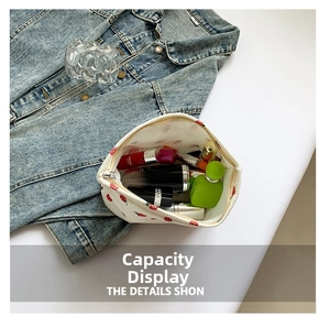 Detailed top view of a white corduroy strawberry tote bag showing large storage capacity