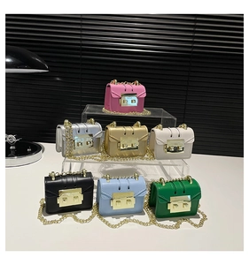Detailed display of mini chain crossbody bags in seven colors on a display stand