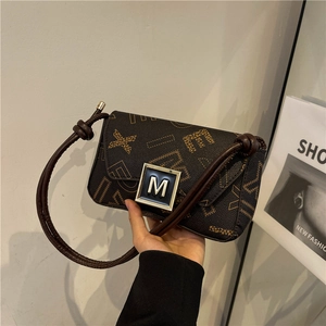 Fashionable brown monogram crossbody bag with silver M logo buckle and shoulder strap