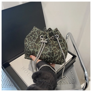Close-up of leopard print bucket bag with silver chain strap and drawstring detail