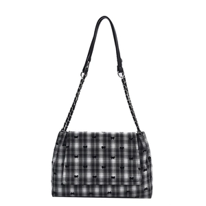 Sac fourre-tout à carreaux noir et blanc avec motifs de nœuds et bandoulière en chaîne métal