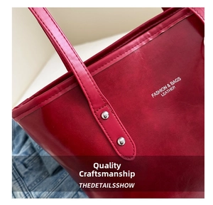 Detail of red PU leather tote bag with silver rivets and white fashion lettering print
