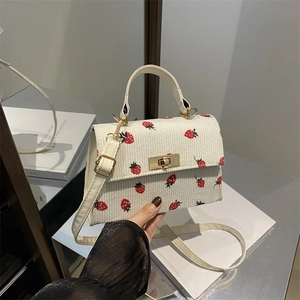 Minimalist beige corduroy crossbody bag with red strawberry embroidery and metal lock