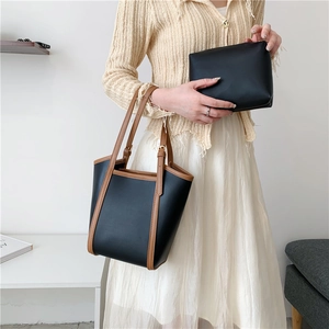 Großes schwarzes Shopper-Set mit braunem Lederbesatz und passender kleiner Clutch