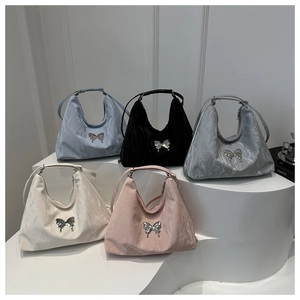 Hobo bags collection with butterfly accents and textured finish in multiple colors