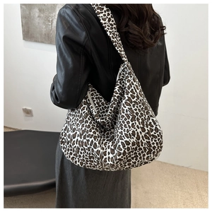 Detailed view of the large leopard print canvas tote bag showing the textured fabric