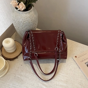 Glossy deep red chain tote bag in premium faux leather for chic commuting style