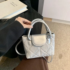 Chic silver quilted bucket bag with metallic finish and top handle for women