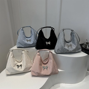 Chic pleated hobo bags with butterfly accent in five colors on display stand
