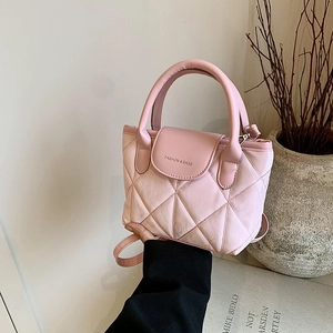 Pink quilted bucket handbag with crossbody strap and elegant rhombic pattern design