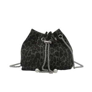 Leopard print bucket bag with silver metal chain drawstring and pearl charms on white background