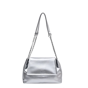 Minimalist silver underarm bag with metallic texture, leather strap, and chain detail
