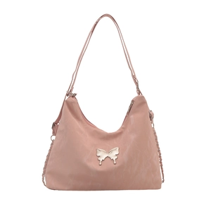 Pink minimalist canvas crossbody bag featuring a silver butterfly buckle and zipper closure