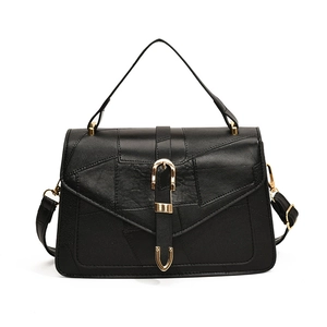 Classic black vintage crossbody bag with patchwork texture and golden hardware