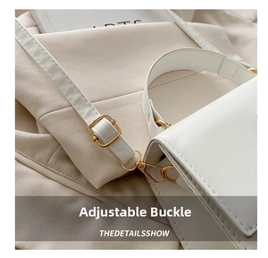 Detail of adjustable gold buckle and hook on white leather crossbody shoulder bag