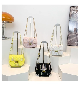 Quilted flap crossbody bags in yellow, pink, white, and black with gold chain straps