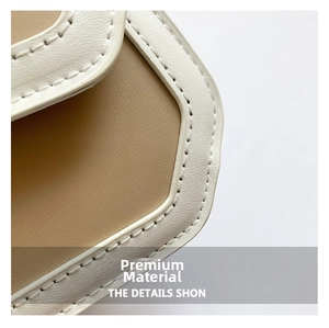Detail of high-quality lychee texture leather stitching with white stitching on small bag